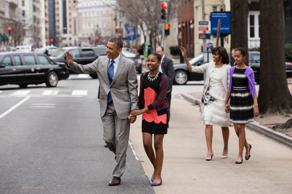President Barack Obama and First Lady Michelle Obama walk with their daughters Sasha and Malia, right, to attend an Easter service at St. John's Church in Washington, D.C., Sunday, March 31, 2013. (Official White House Photo by Pete Souza) This official White House photograph is being made available only for publication by news organizations and/or for personal use printing by the subject(s) of the photograph. The photograph may not be manipulated in any way and may not be used in commercial or political materials, advertisements, emails, products, promotions that in any way suggests approval or endorsement of the President, the First Family, or the White House. 