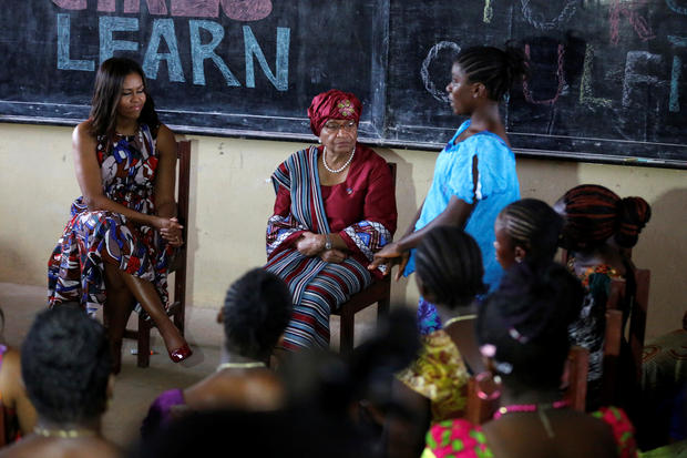 U.S. first lady Michelle Obama (L) sits with Liberian President Ellen Johnson Sirleaf as she talks with students at the R. S. Caulfield School girls center in Margibi County, Liberia, June 27, 2016. REUTERS/Thierry Gouegnon - RTX2IKSG