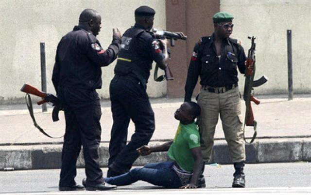 protest_pictures_Ademola_Aderinde_being_molested_150851430